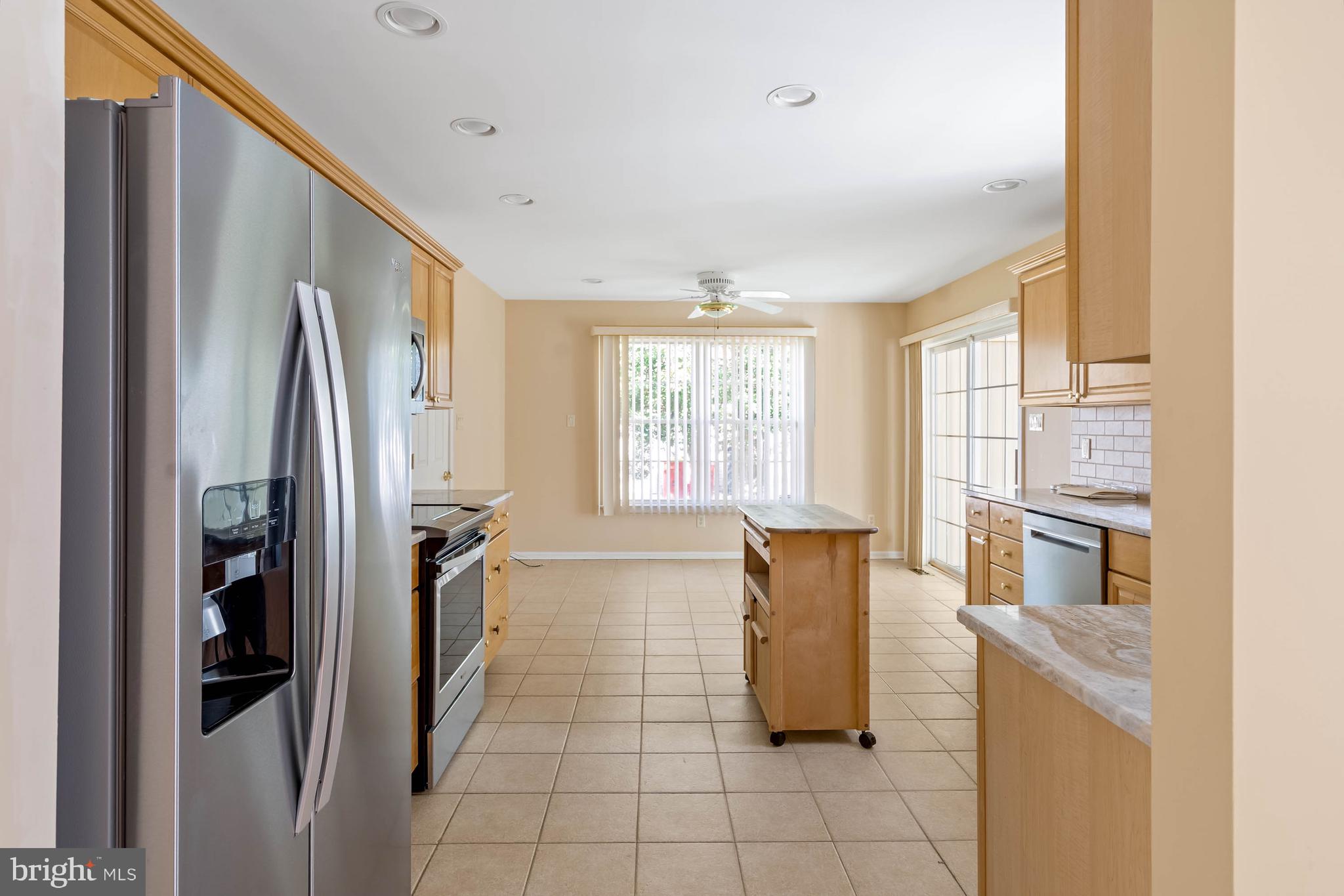 4 Alderleaf Drive Lewes, DE 19958 - Photo 10 of 43 a kitchen with stainless steel appliances granite countertop a refrigerator and a stove