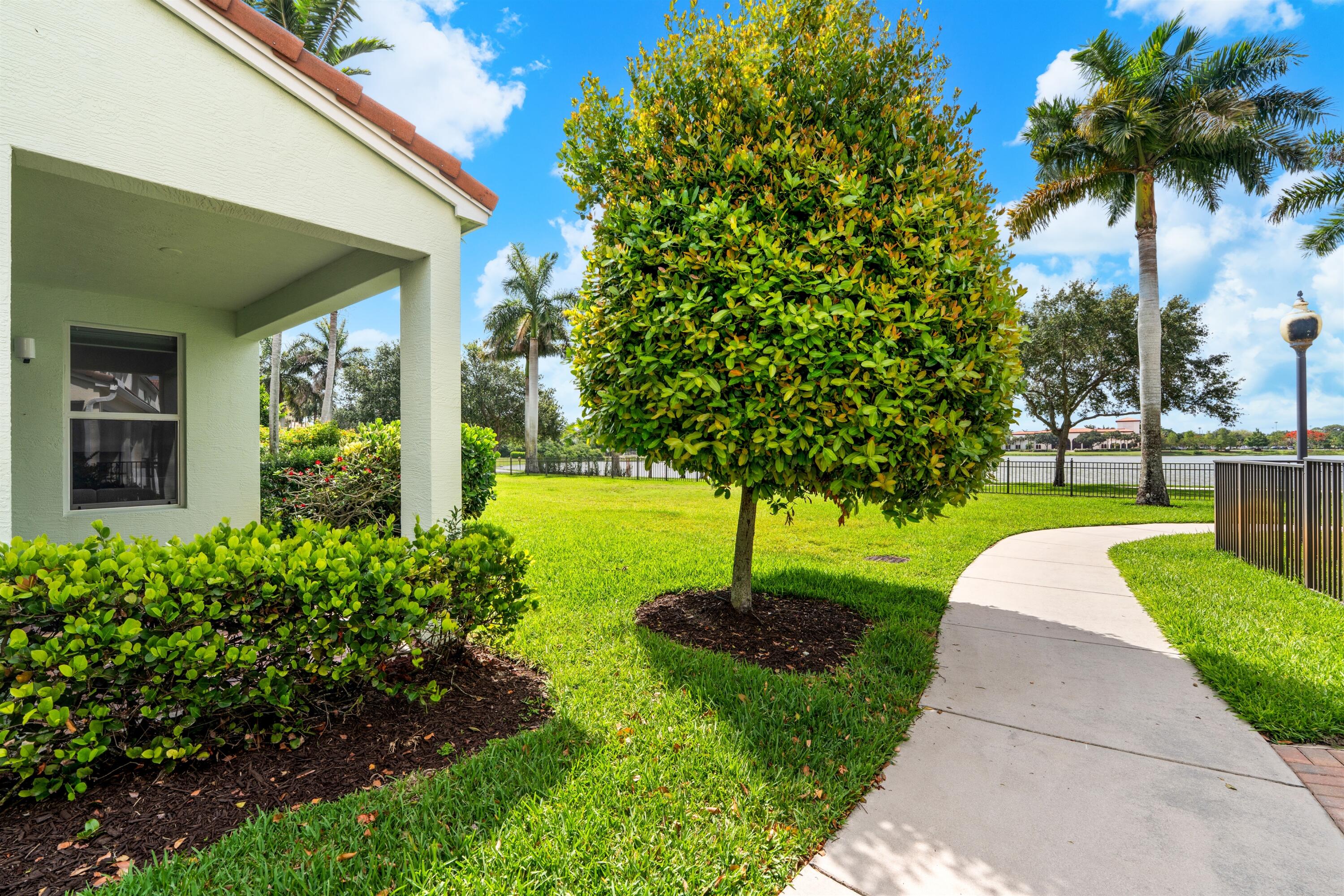 1570 Northwest 48th Place Boca Raton, FL 33431 - Photo 29 of 30 a front view of a house with garden