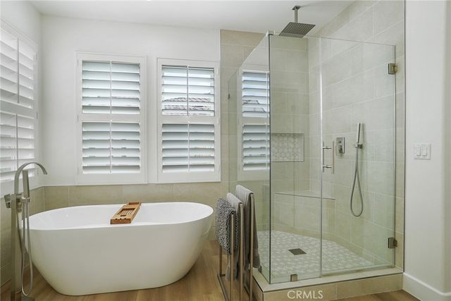 a bathroom with a bathtub and shower