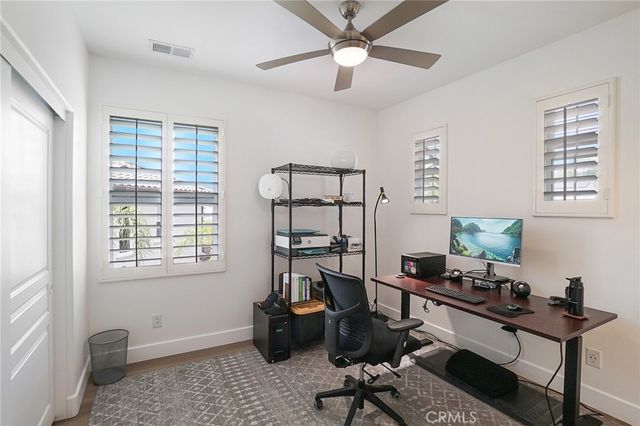 a spacious bathroom with a double vanity sink a mirror a toilet and a shower