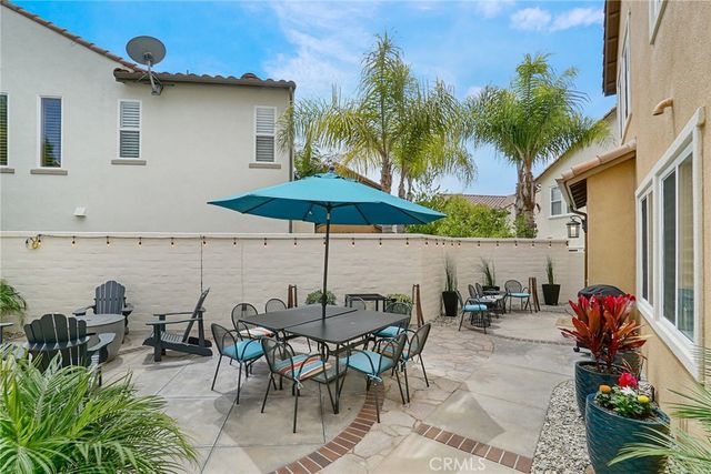 a view of a backyard with plants and lake view