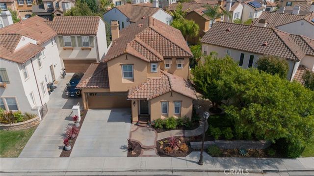 an aerial view of multiple houses with yard