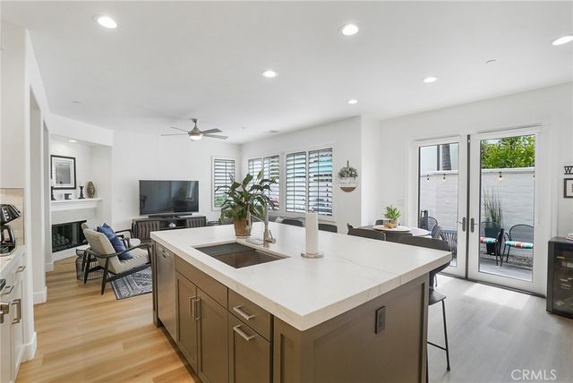 a kitchen with a stove a sink and a refrigerator