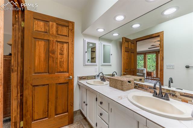 475 Cimarron Road Monument, CO 80132 - Photo 17 of 34 Primary Bathroom- Brand New Sinks, Backsplash and Counters!