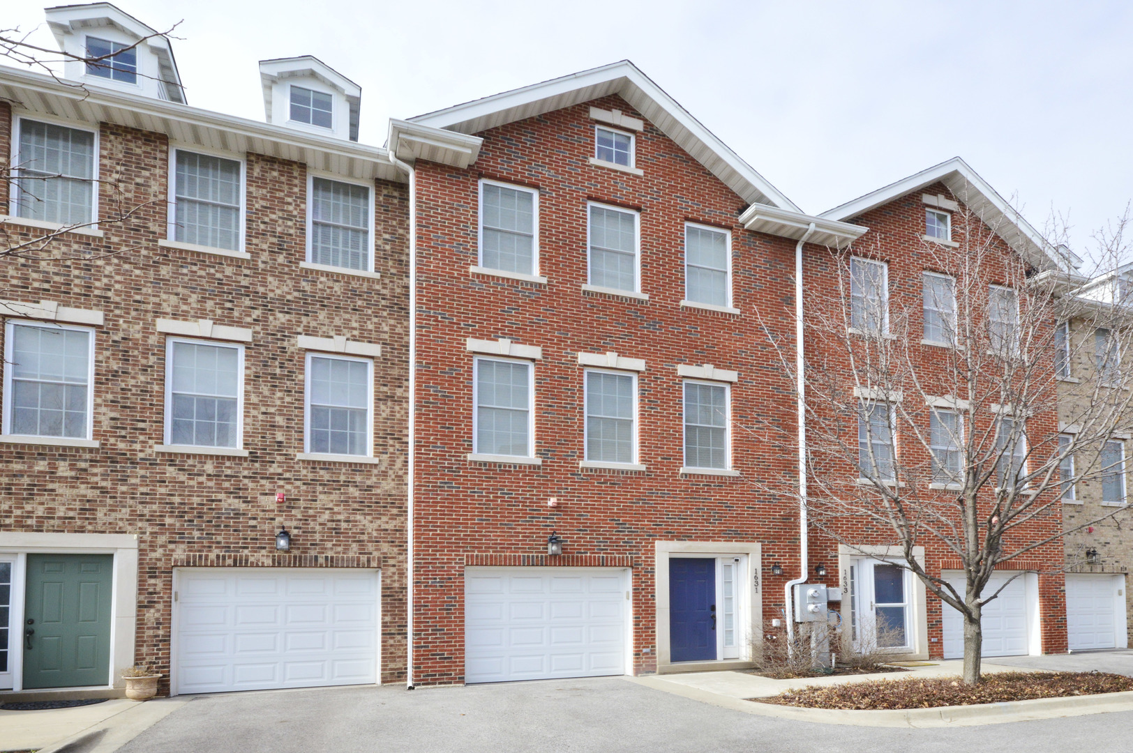 1631 Church Street Evanston, IL 60201 - Photo 1 of 19 a front view of a building with a street
