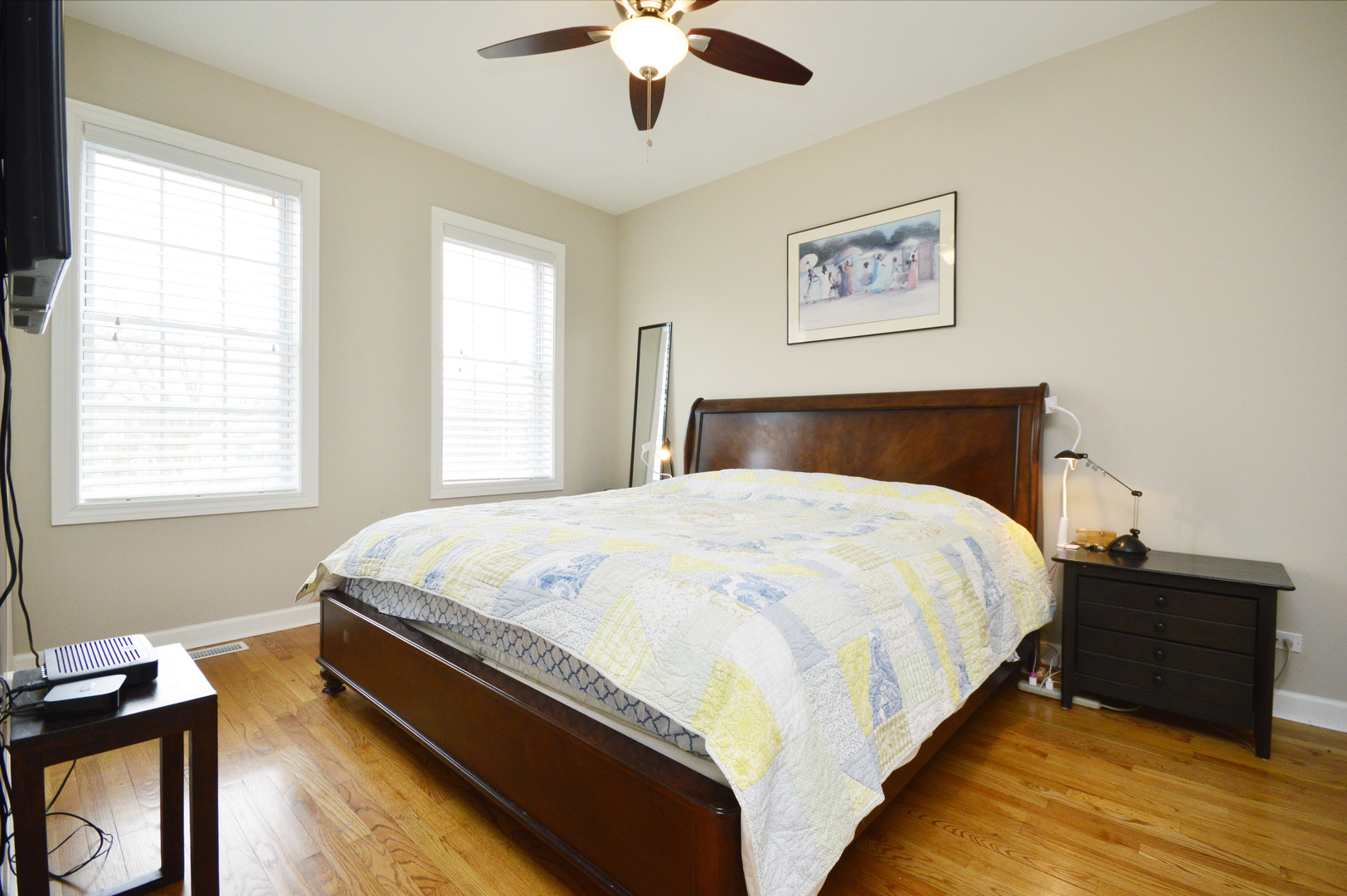 1631 Church Street Evanston, IL 60201 - Photo 12 of 19 a large bed sitting in a bedroom next to a window