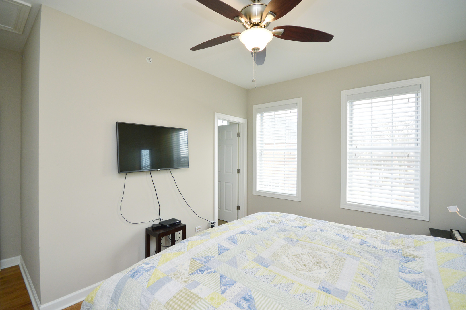 1631 Church Street Evanston, IL 60201 - Photo 13 of 19 a bedroom with a bed and a flat screen tv