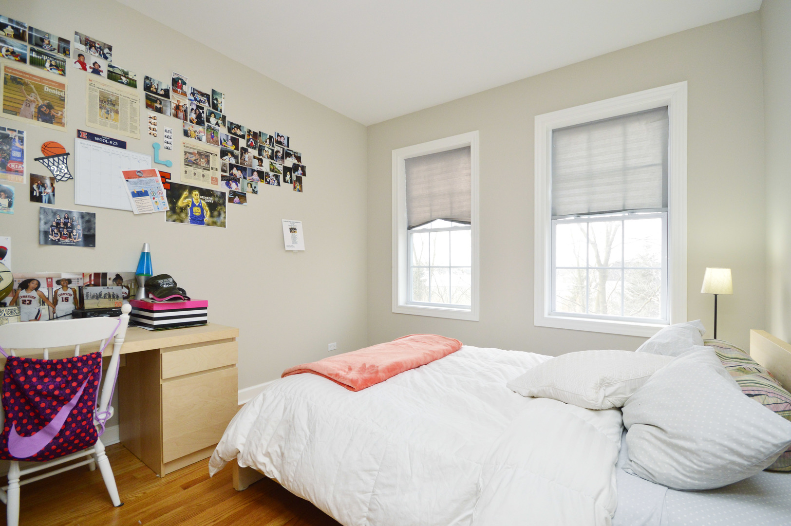 1631 Church Street Evanston, IL 60201 - Photo 17 of 19 a bedroom with a bed and a chair in it
