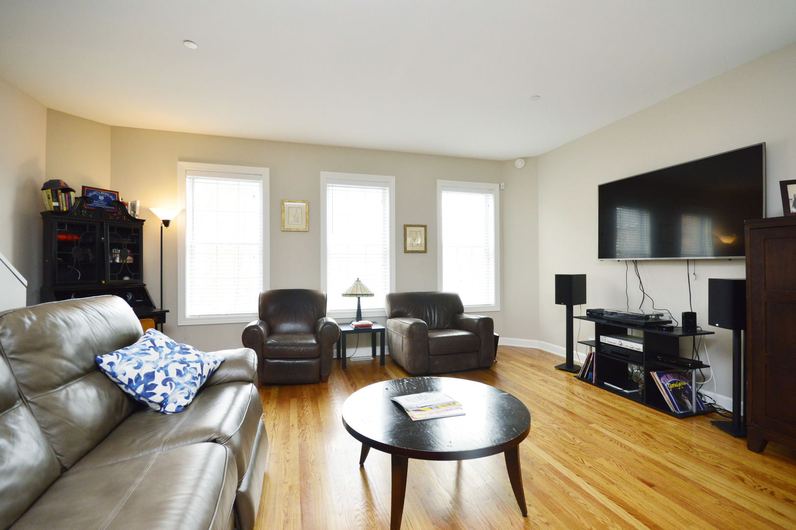 1631 Church Street Evanston, IL 60201 - Photo 2 of 19 a living room with furniture and a flat screen tv