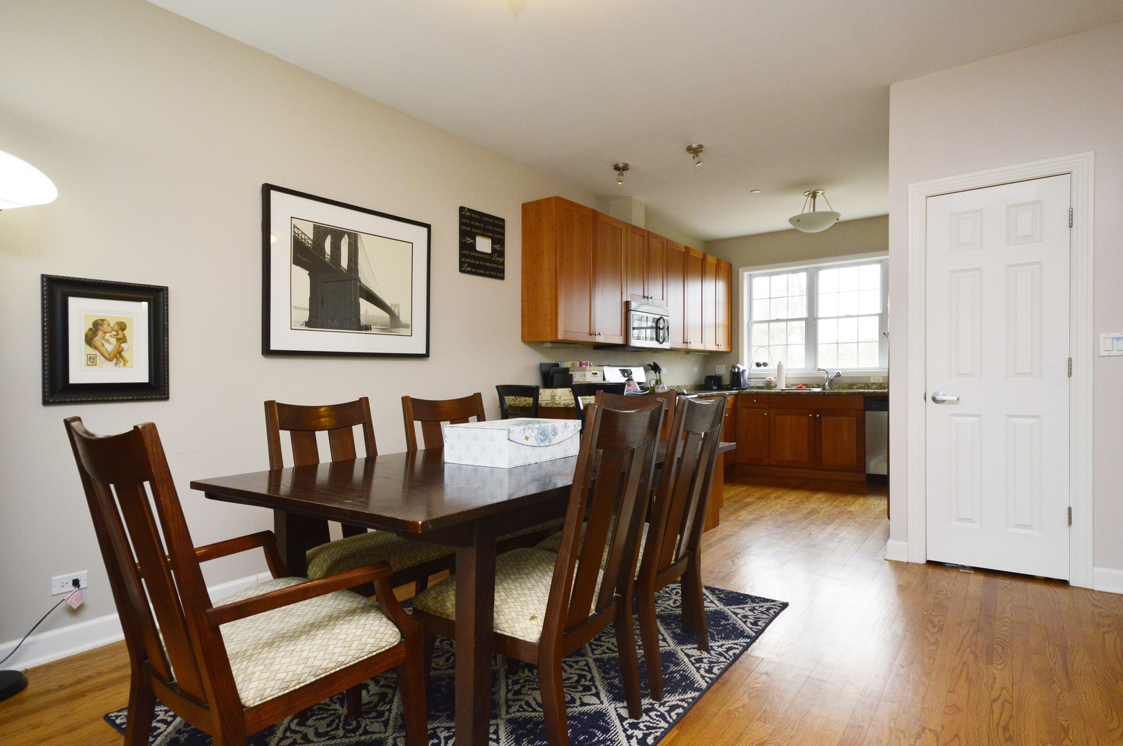 1631 Church Street Evanston, IL 60201 - Photo 5 of 19 a view of a dining room with furniture and wooden floor