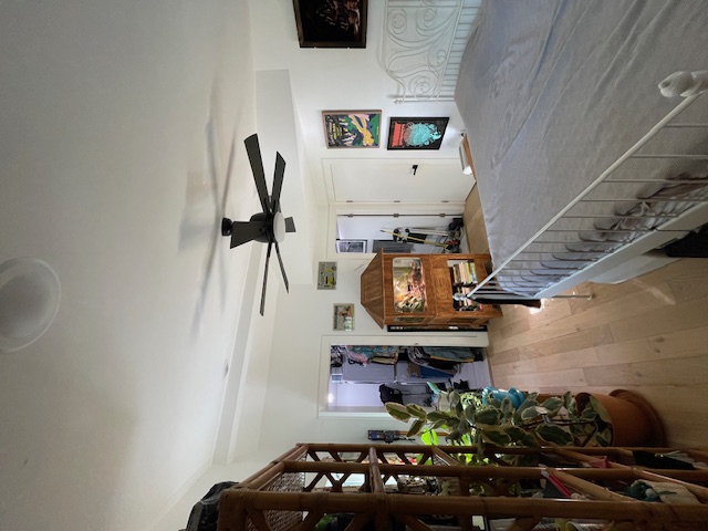 2910 Pecan Springs Road, Unit A Austin, TX 78723 - Photo 19 of 39 Bedroom with light wood finished floors and ceiling fan