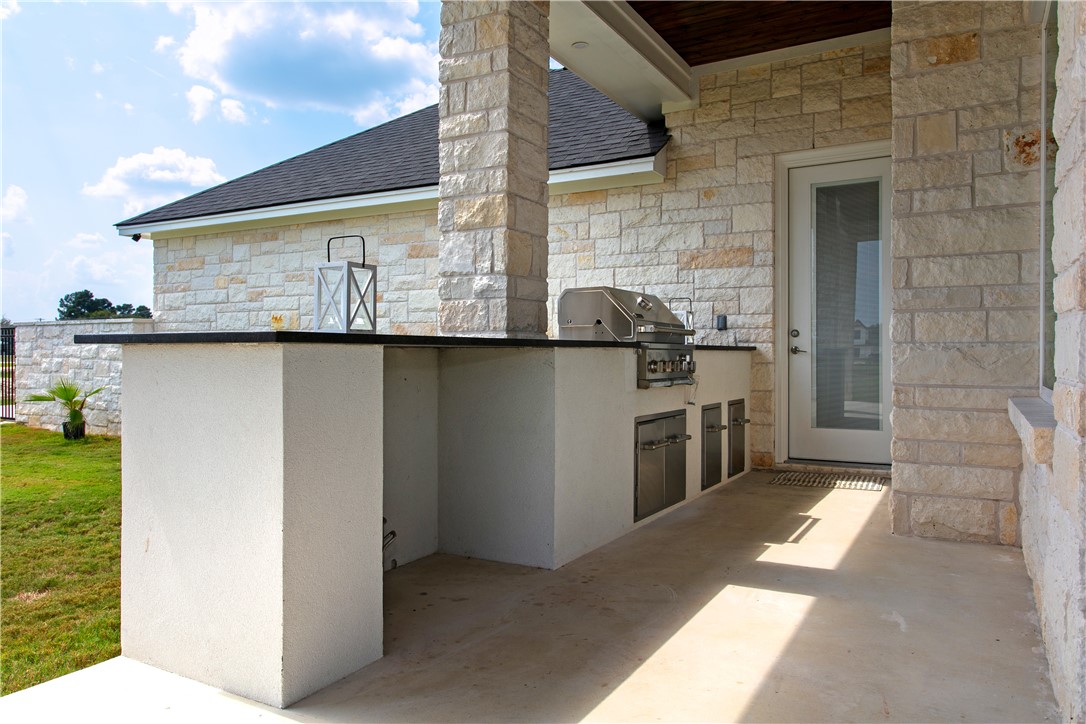 7844 Mathis Crk Drive Bryan, TX 77808 - Photo 33 of 41 View of patio / terrace with exterior kitchen