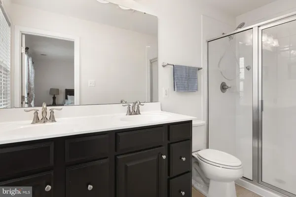 a bathroom with a sink toilet and vanity