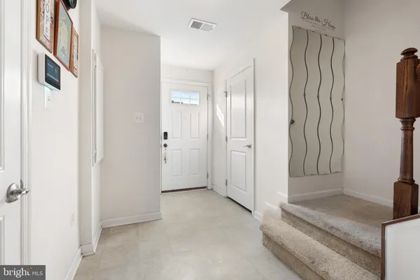 a view of a closet area with ceiling fan