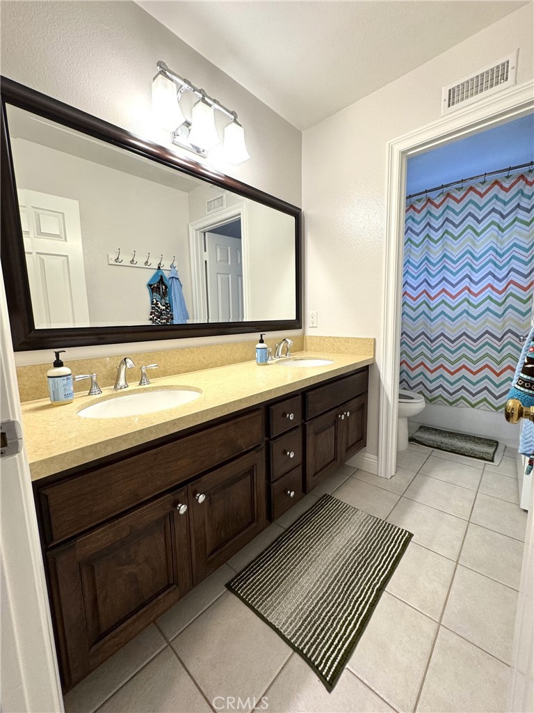 8115 East Star Pine Road Orange, CA 92869 - Photo 13 of 22 Full bath upstairs with dual sinks.