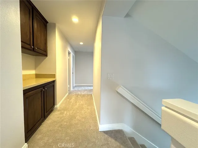 a view of a kitchen cabinets and wooden floor