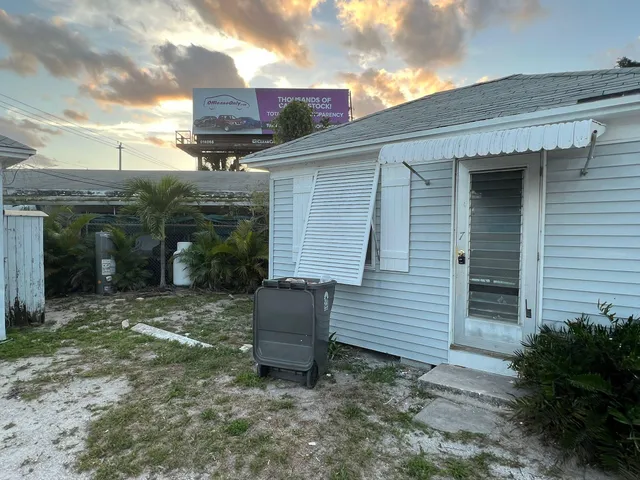 a backyard of a house with seating space