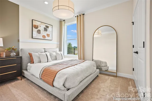 a bedroom with bed and a window