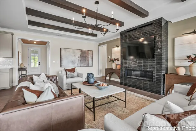 a living room with furniture and a flat screen tv