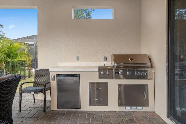 a bathroom with a shower sink vanity and mirror