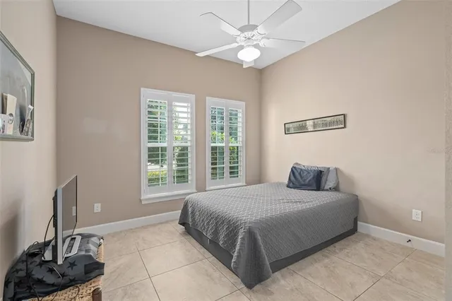 a front view of a house with patio and wooden fence