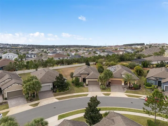 a view of a patio with table and chairs