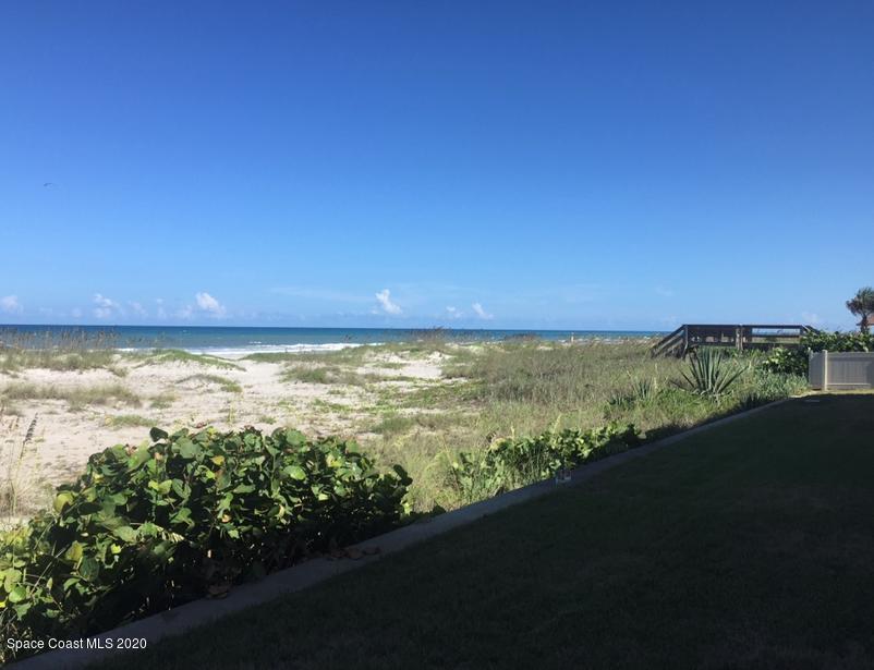 1305 South Atlantic Avenue, Unit 120 Cocoa Beach, FL 32931 - Photo 6 of 10 a view of an ocean from a yard