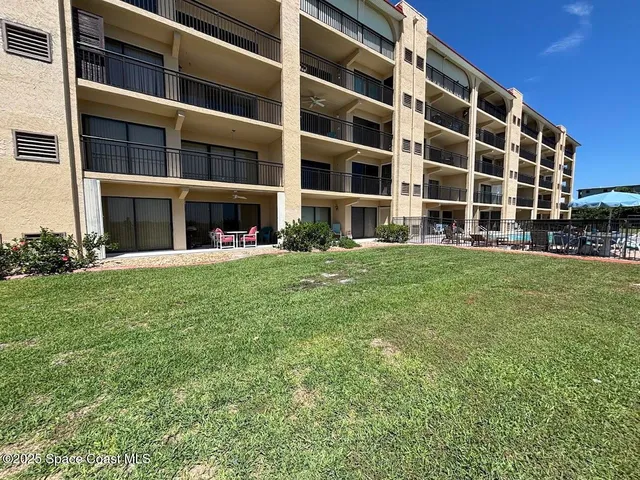 a view of building with yard