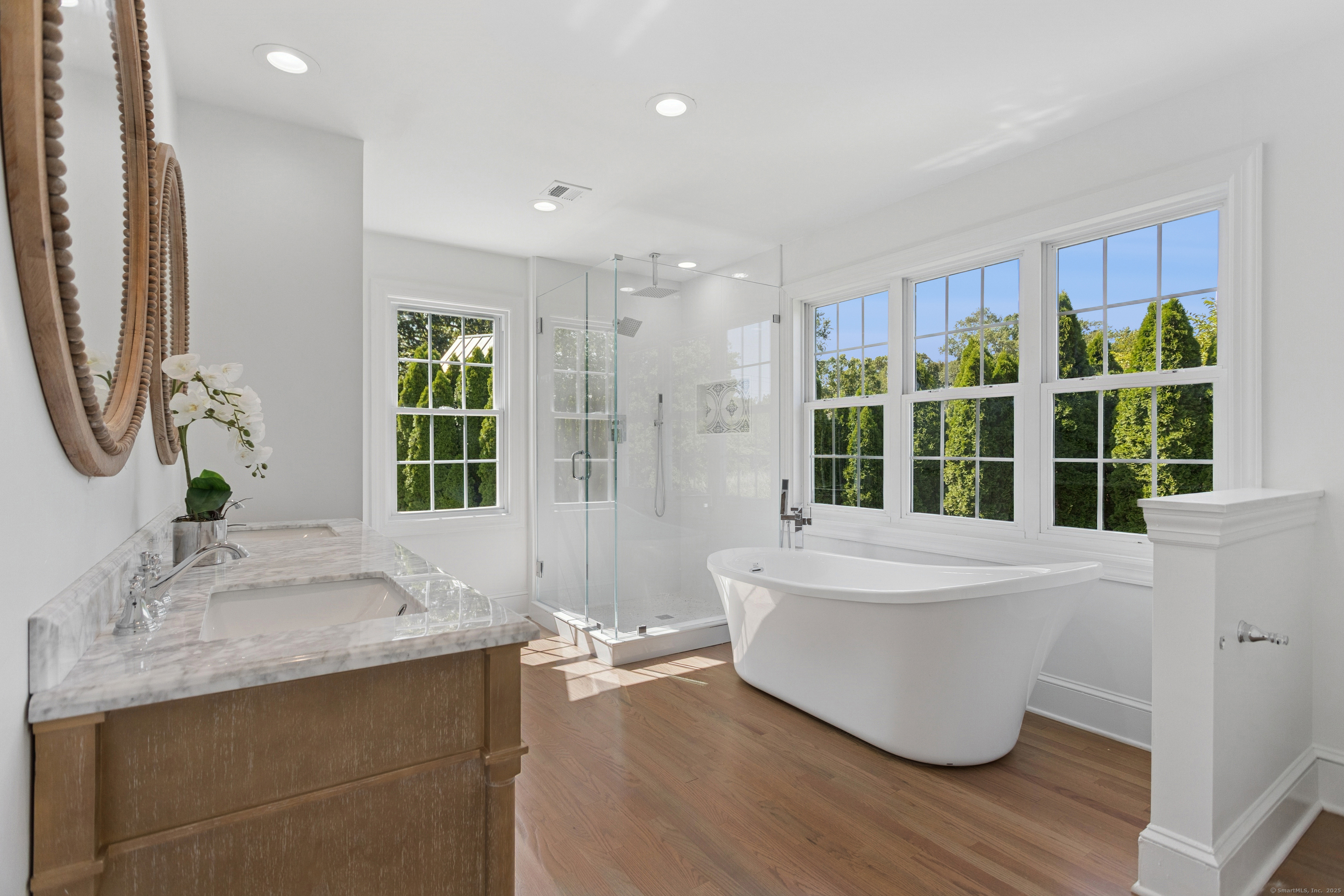 61 Edgewater Commons Lane Westport, CT 06880 - Photo 18 of 37 a spacious bathroom with a double vanity sink and a large mirror