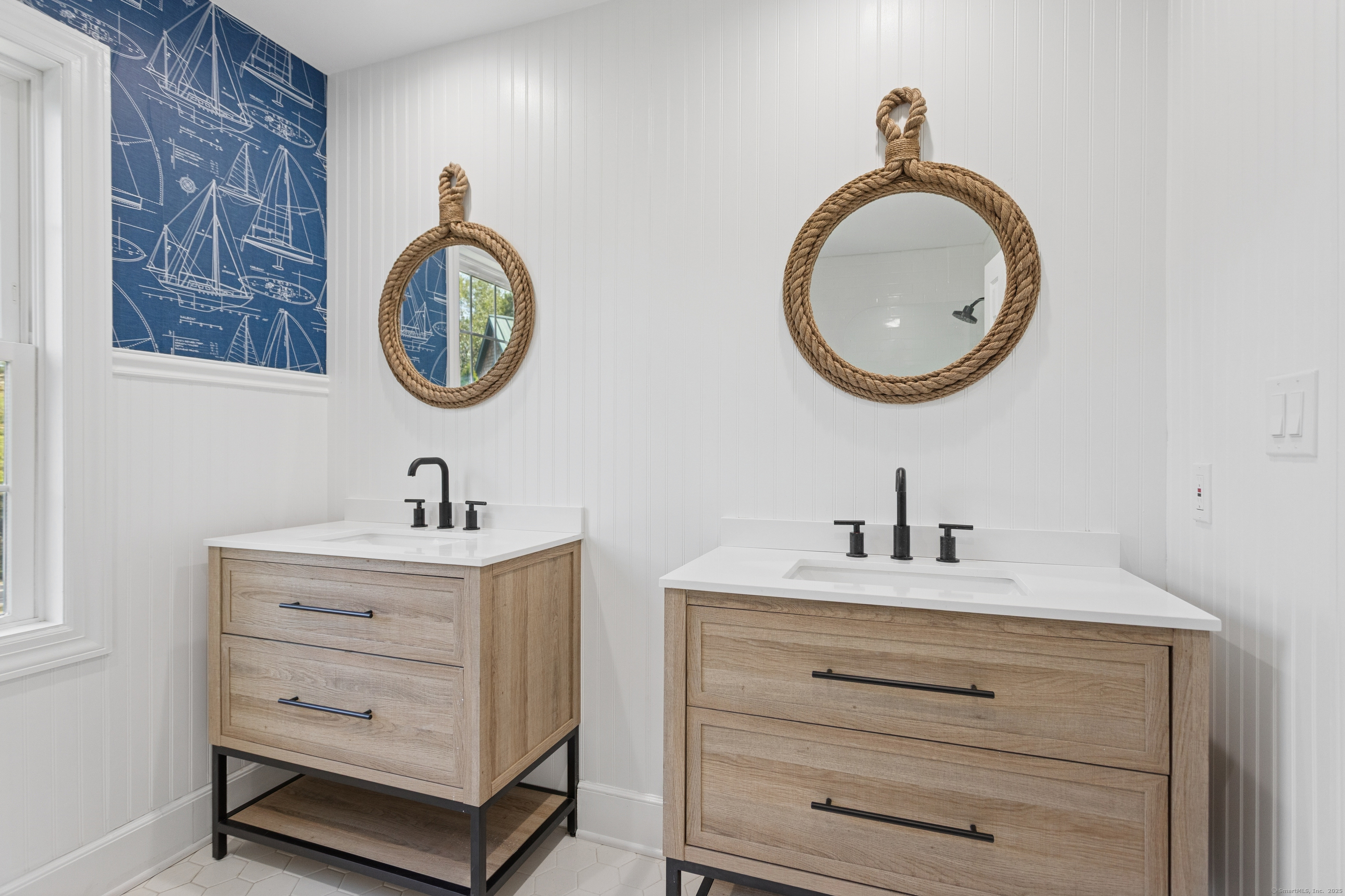 61 Edgewater Commons Lane Westport, CT 06880 - Photo 25 of 37 a bathroom with a sink and a mirror