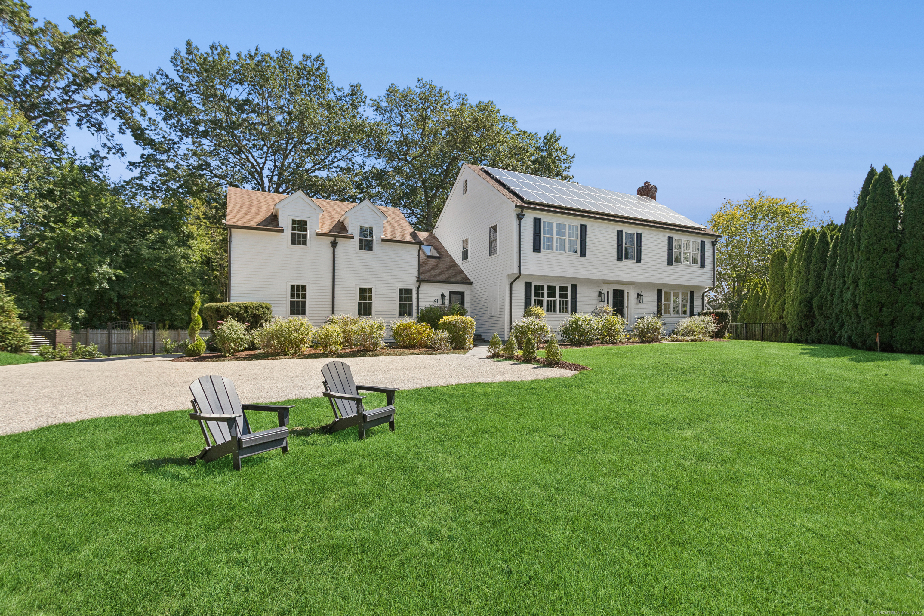 61 Edgewater Commons Lane Westport, CT 06880 - Photo 33 of 37 a view of a house with a yard and sitting area