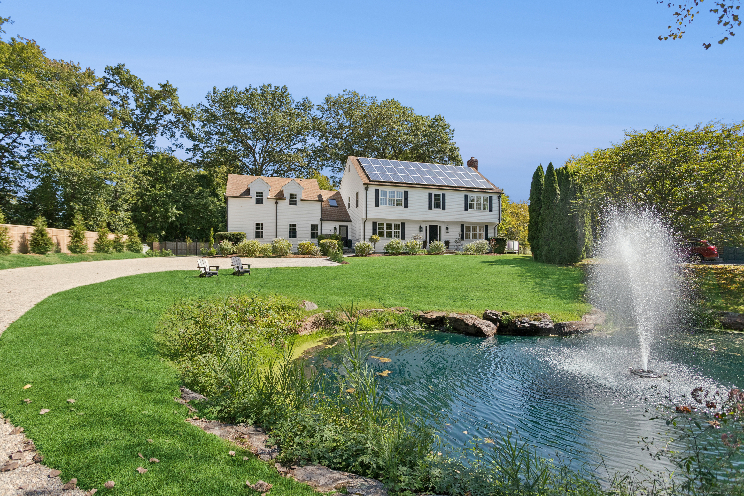 61 Edgewater Commons Lane Westport, CT 06880 - Photo 4 of 37 a view of a house with a big yard