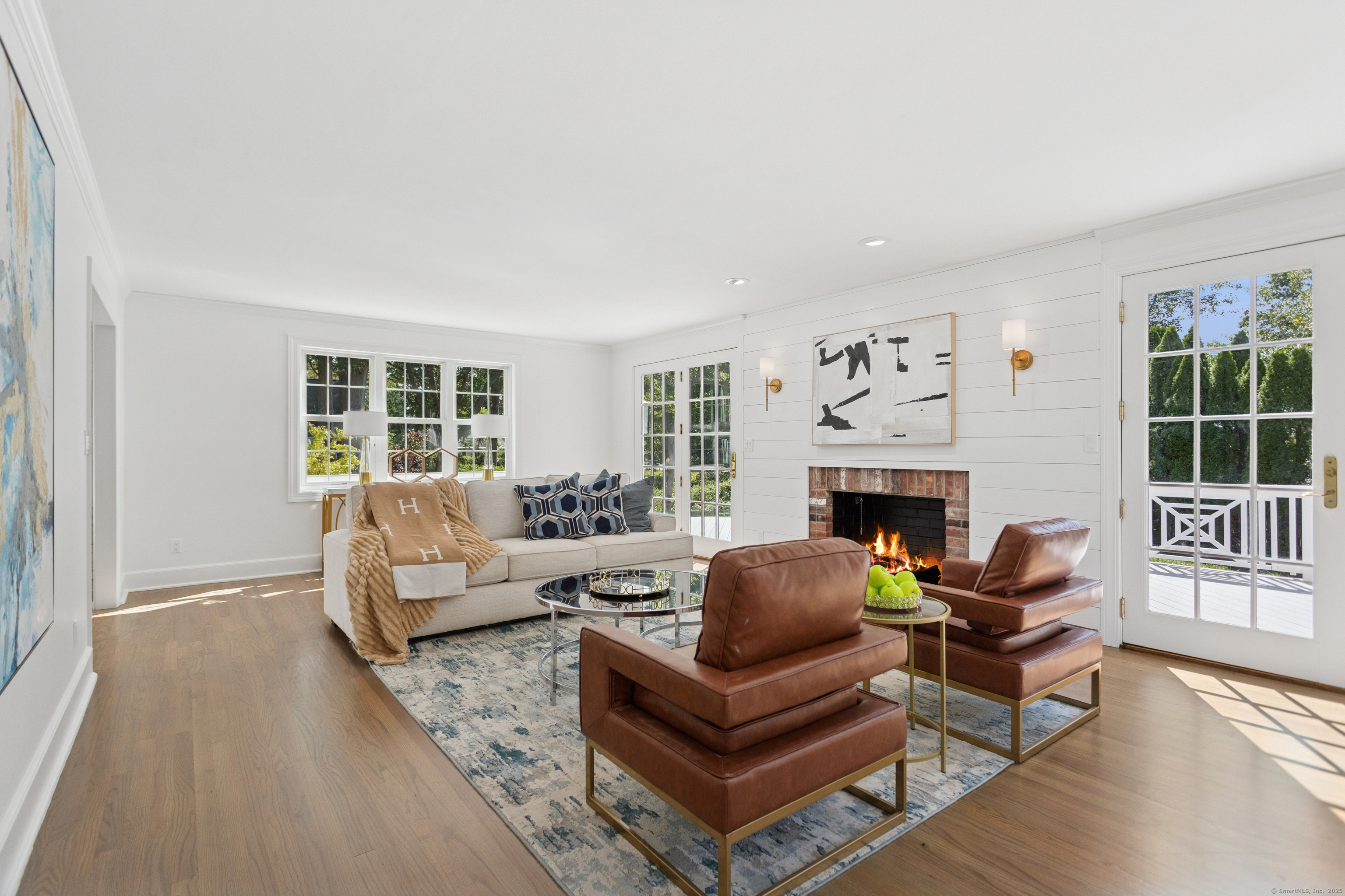 61 Edgewater Commons Lane Westport, CT 06880 - Photo 5 of 37 a living room with furniture large window and a fireplace