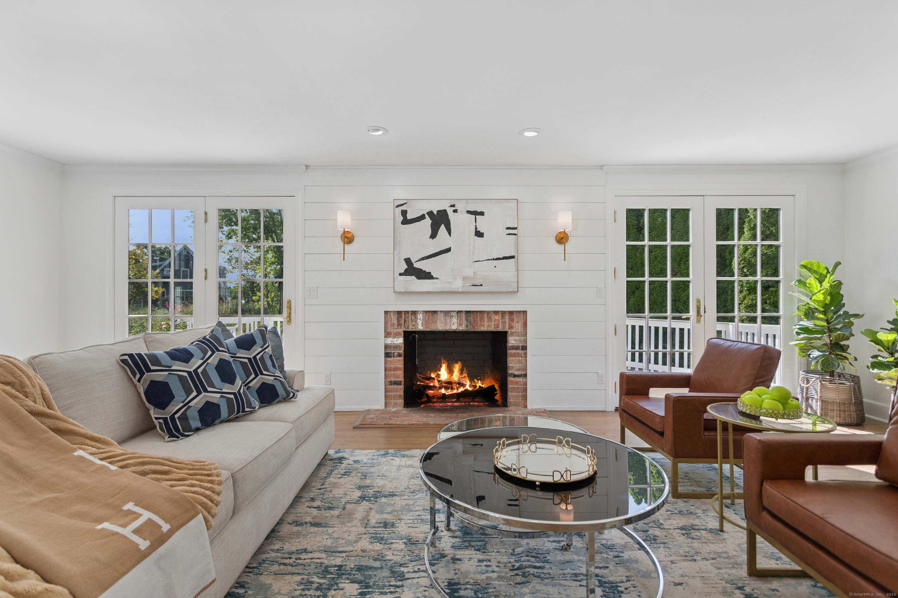 61 Edgewater Commons Lane Westport, CT 06880 - Photo 6 of 37 a living room with furniture and a fireplace