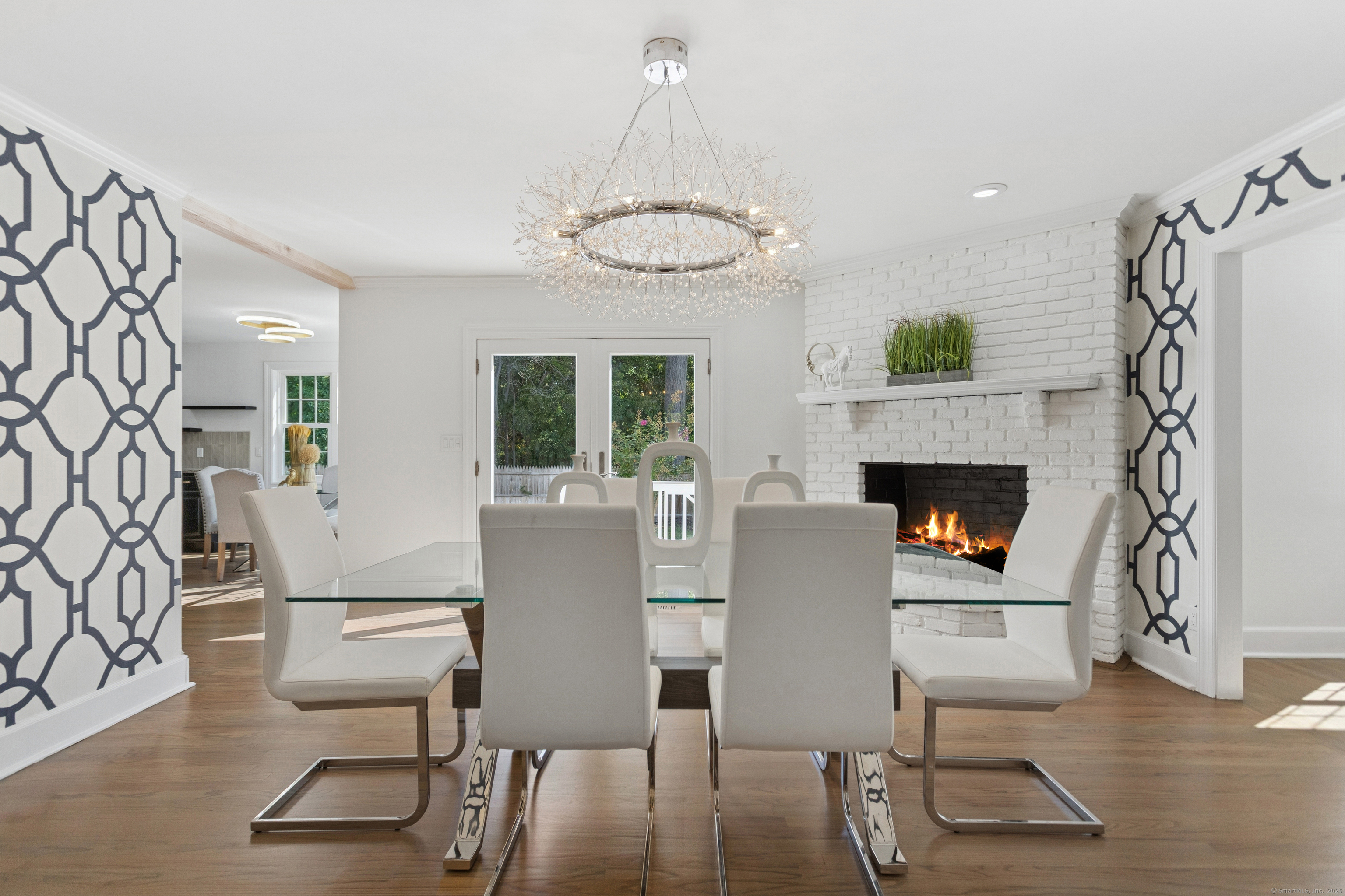 61 Edgewater Commons Lane Westport, CT 06880 - Photo 8 of 37 a living room with furniture a table and a fireplace