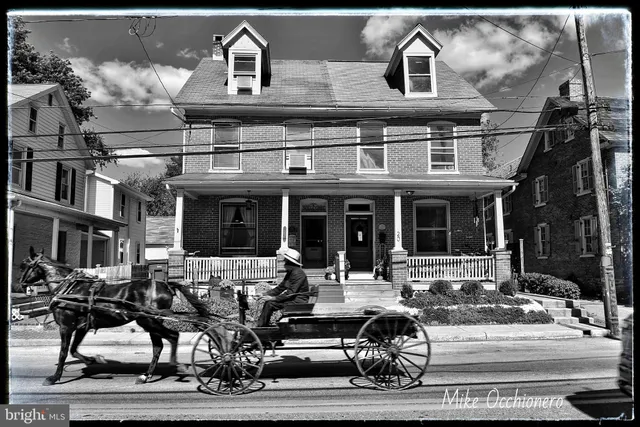 a view of a building with sitting area