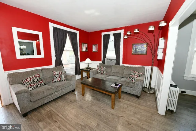 a living room with furniture and a window