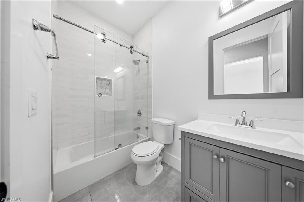 3261 15th Avenue Southwest Naples, FL 34117 - Photo 15 of 20 Bathroom featuring combined bath / shower with glass door and vanity