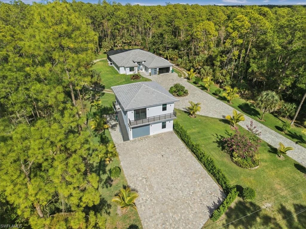 3261 15th Avenue Southwest Naples, FL 34117 - Photo 17 of 20 View from above of property featuring a forest