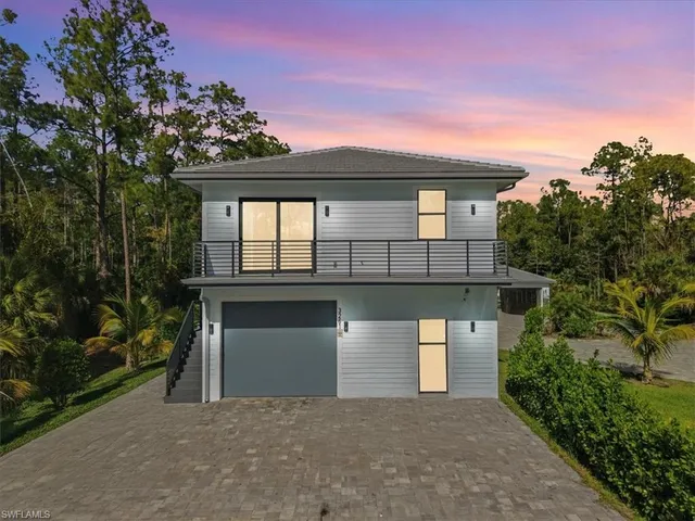 a front view of a house with a garage