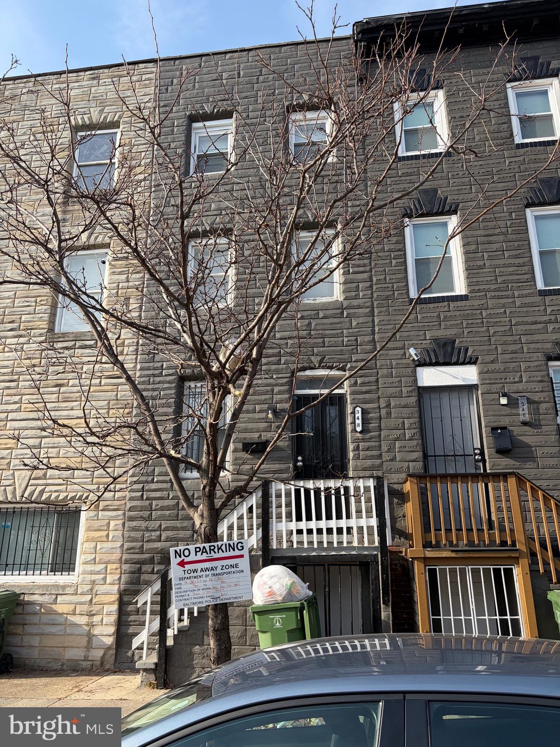 a view of a brick house with many windows