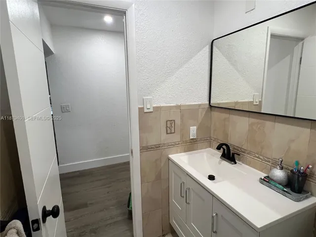 a bathroom with a sink and mirror