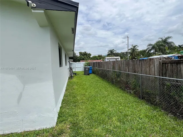 a backyard of a house with lots of green space