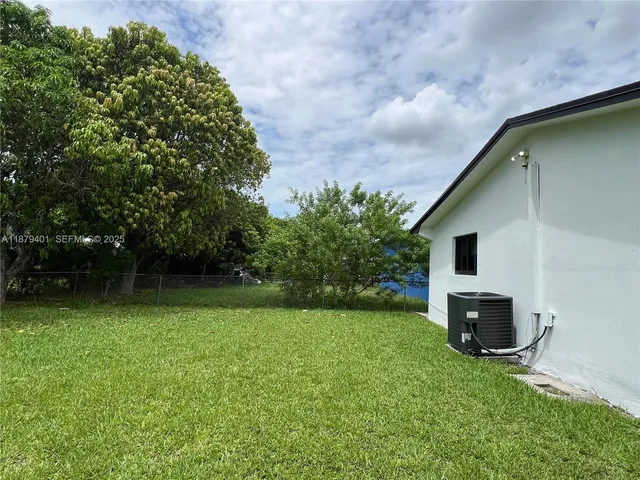a backyard of a house with lots of green space