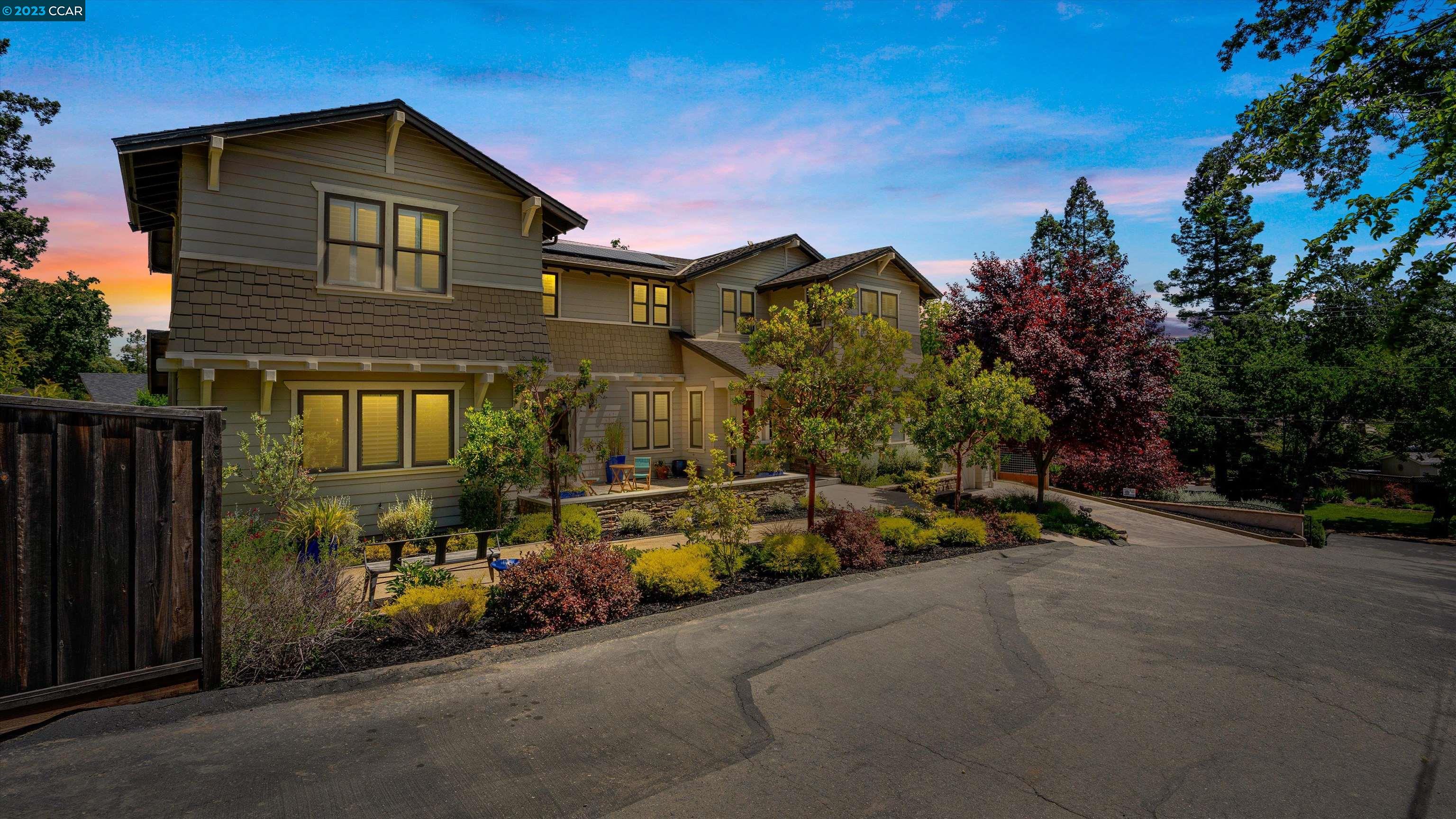 a view of a car park in front of a house