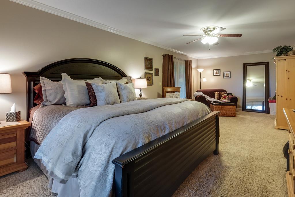 801 High Point Ridge Road Franklin, TN 37069 - Photo 20 of 29 a bedroom with a bed and a chandelier