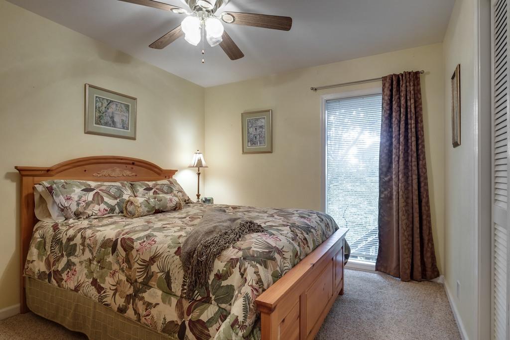 801 High Point Ridge Road Franklin, TN 37069 - Photo 22 of 29 a bedroom with a large bed and a chandelier