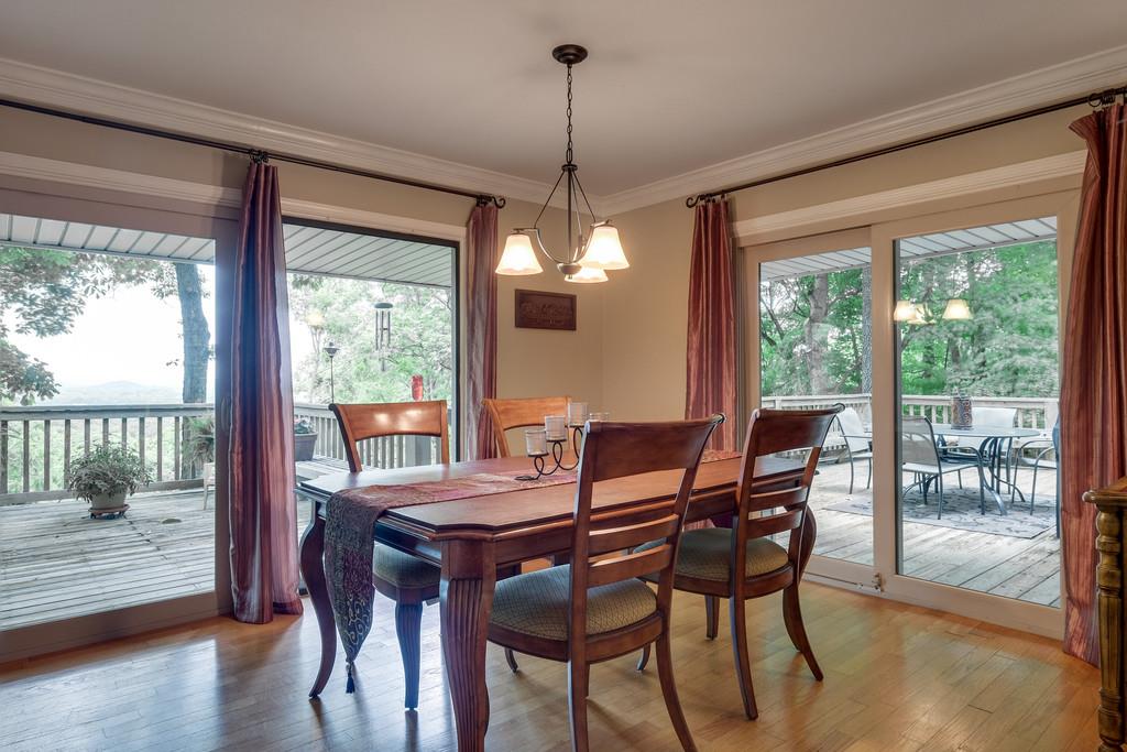 801 High Point Ridge Road Franklin, TN 37069 - Photo 10 of 29 a dining room with furniture a chandelier and wooden floor