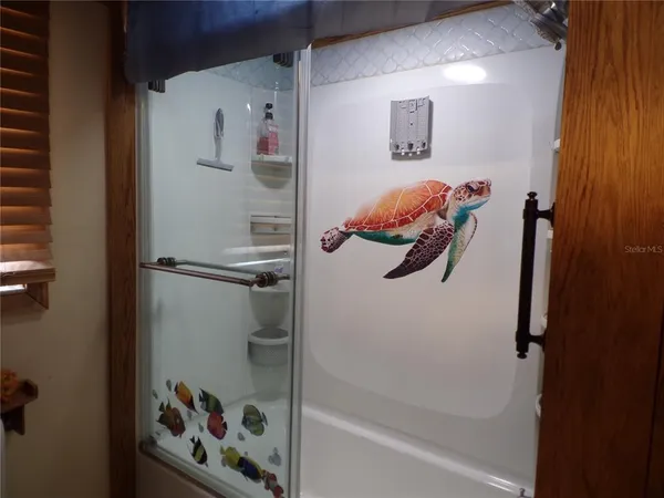 a bathroom with a shower and a sink