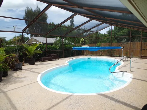 a view of a swimming pool with a patio